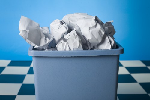 Loading a skip with household waste