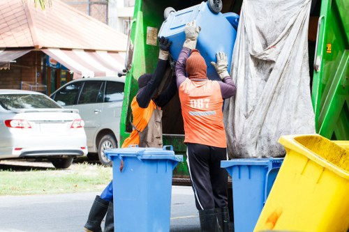 Modern skip being placed on a construction site