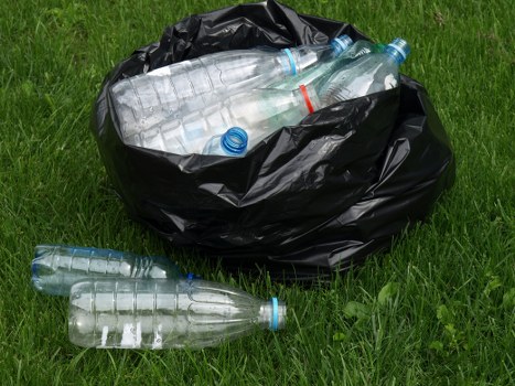 Hazardous waste being safely handled and disposed of
